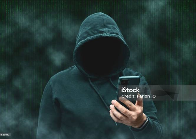 Stalker holding a phone